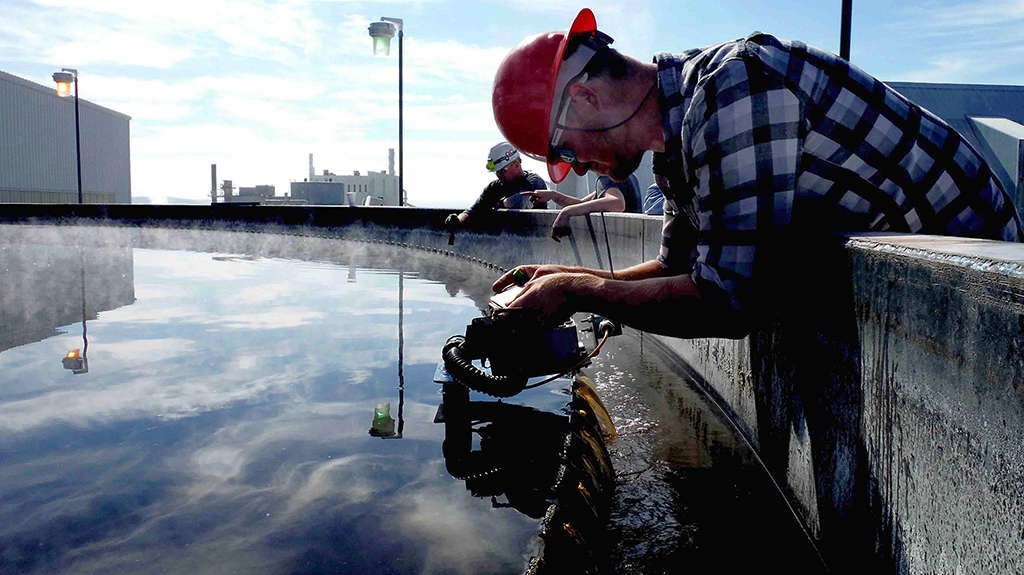 Plant operator checking thickener bed level measurements with MudMax