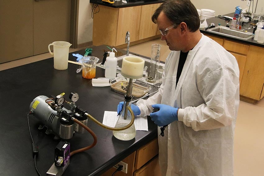 Mike Chambers doing a vacuum filtration procedure