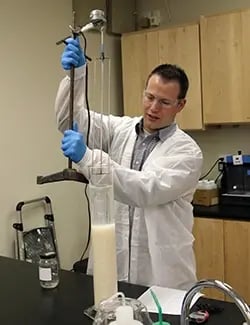 Brandt Anderson conducting a sedimentation test