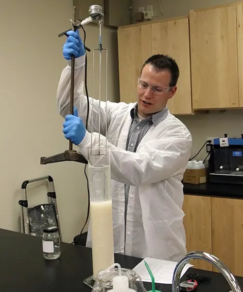 Brandt Anderson conducting a sedimentation test