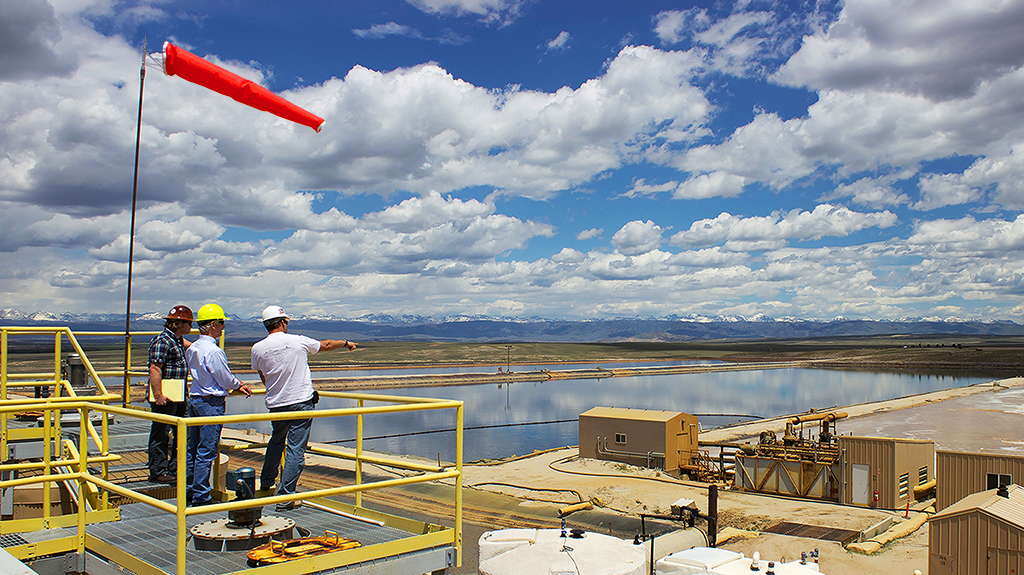 Workers surveying operations for hydraulic fracturing