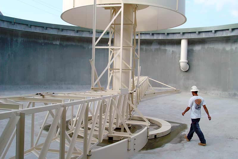 Empty COP Clarifier tank with worker inside