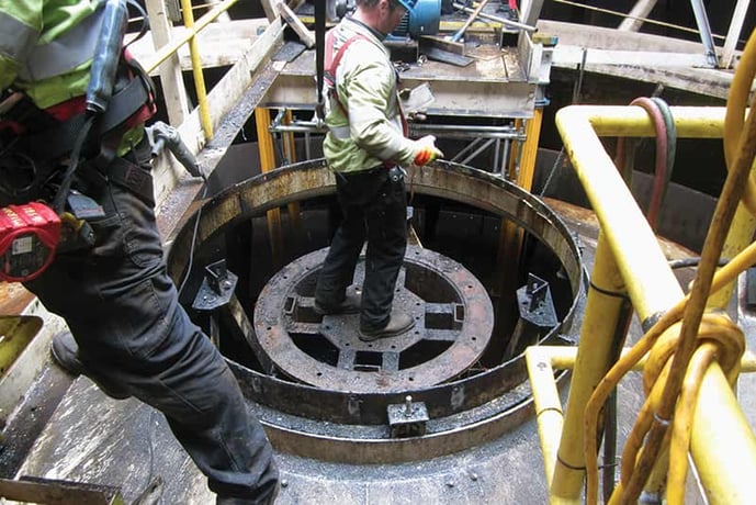 Workmen removing old clarifier drive unit
