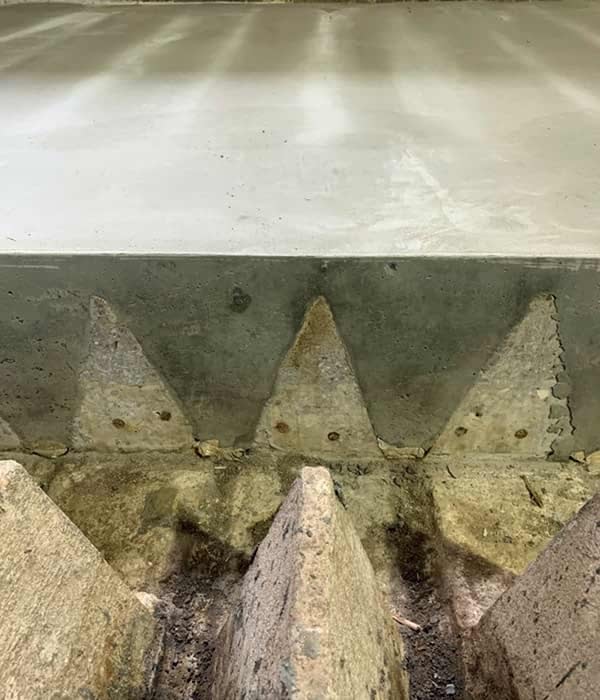 Old underdrain teepees with concrete fill