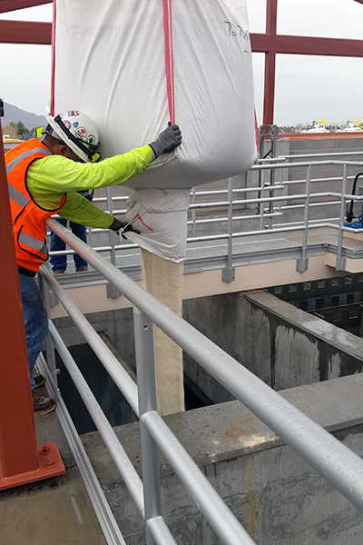 worker adding sand to the RapiSand ballasted flocculation tank